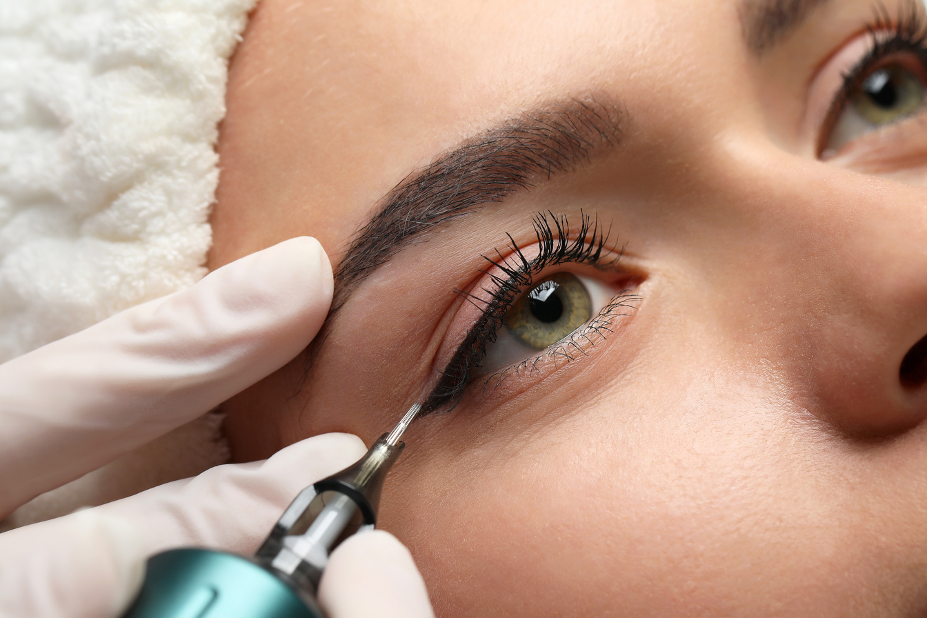 Young Woman Undergoing Procedure of Permanent Eye Makeup, Closeu